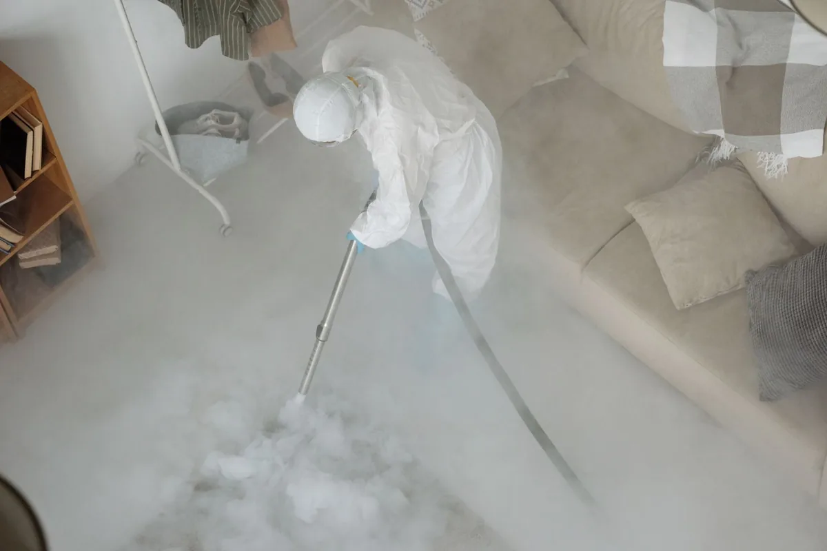 Biohazard cleanup technician in protective equipment, South Run, VA